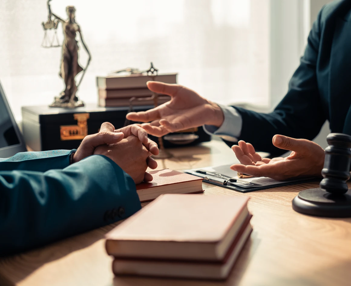 Hands gesturing in legal office discussion