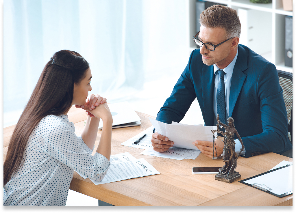 Lawyer discussing documents with client