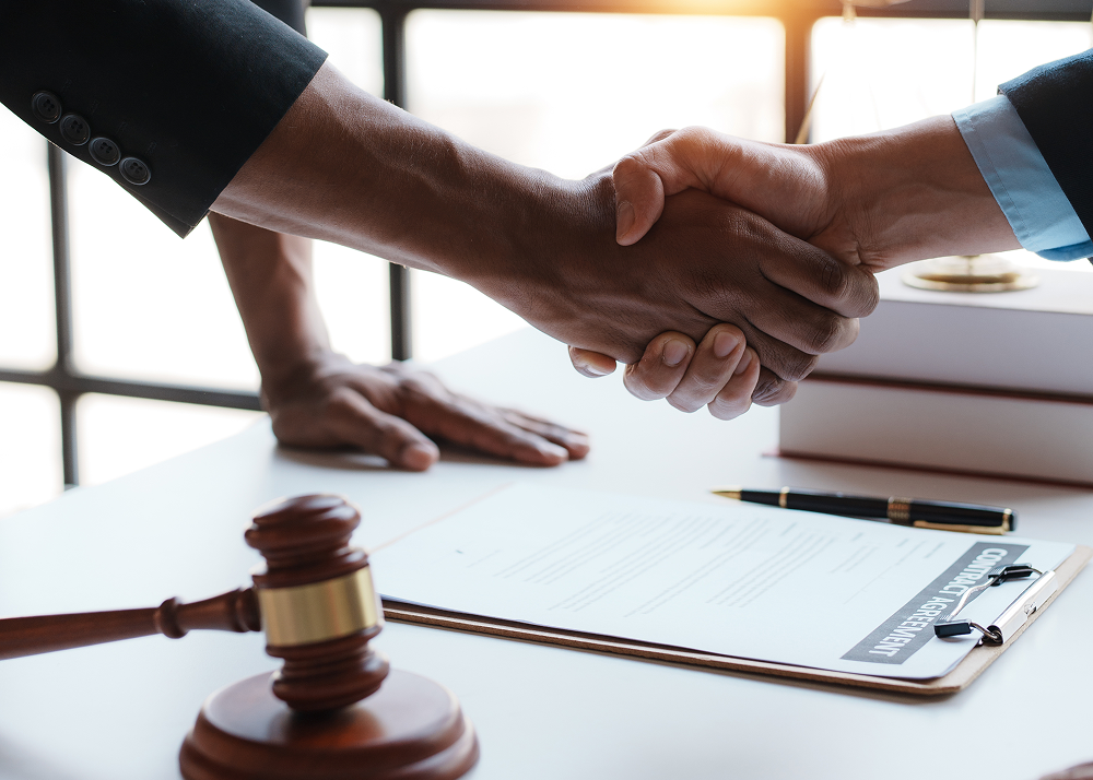 Legal deal handshake scene